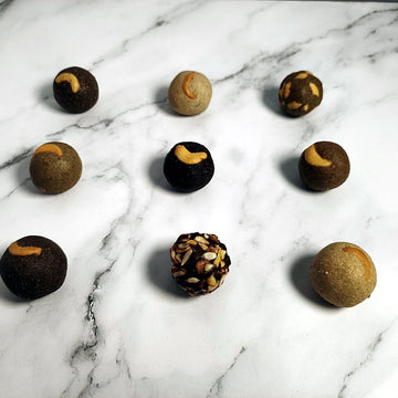 Assorted Orgville nutri-laddus on marble